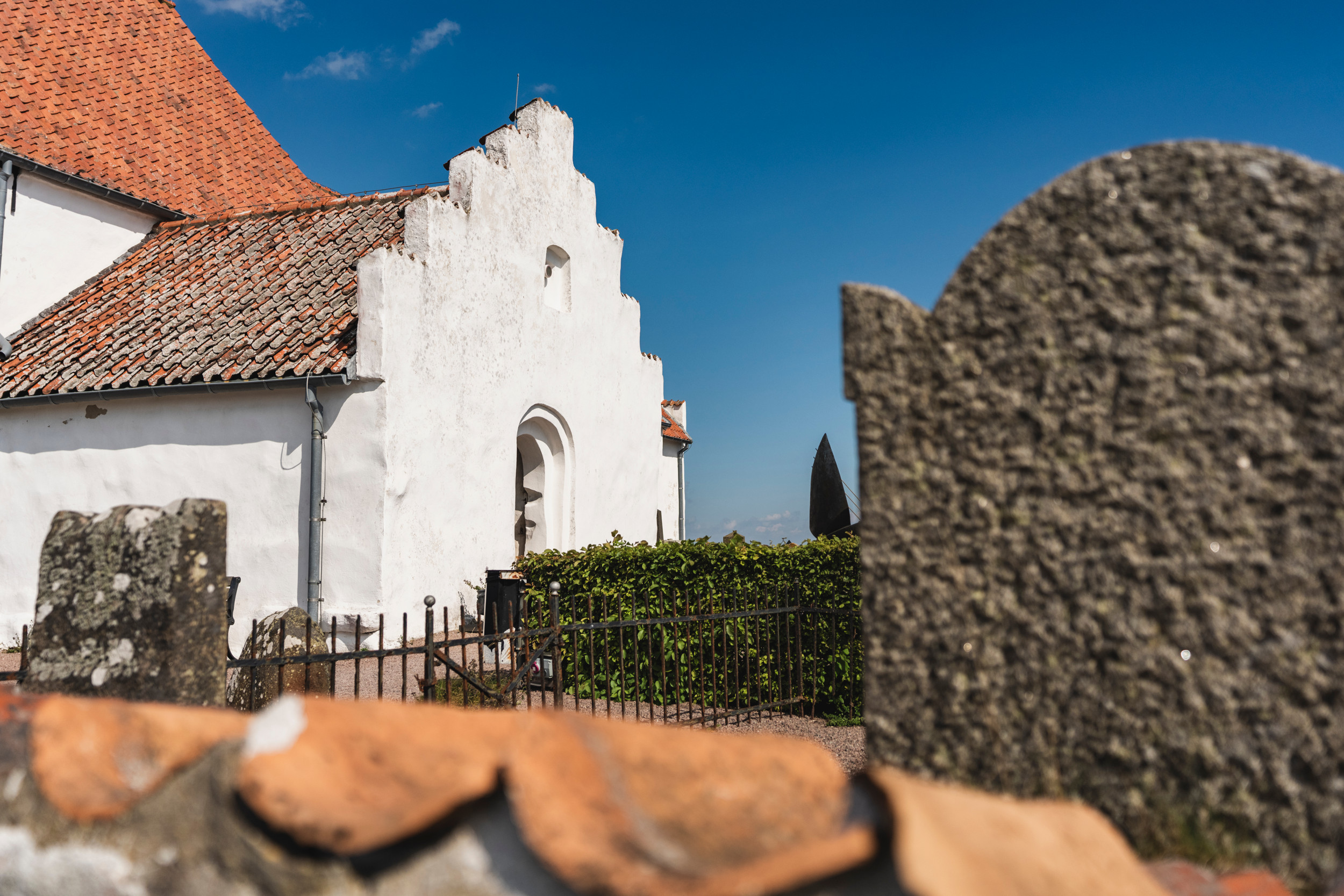 Four people are watching a map