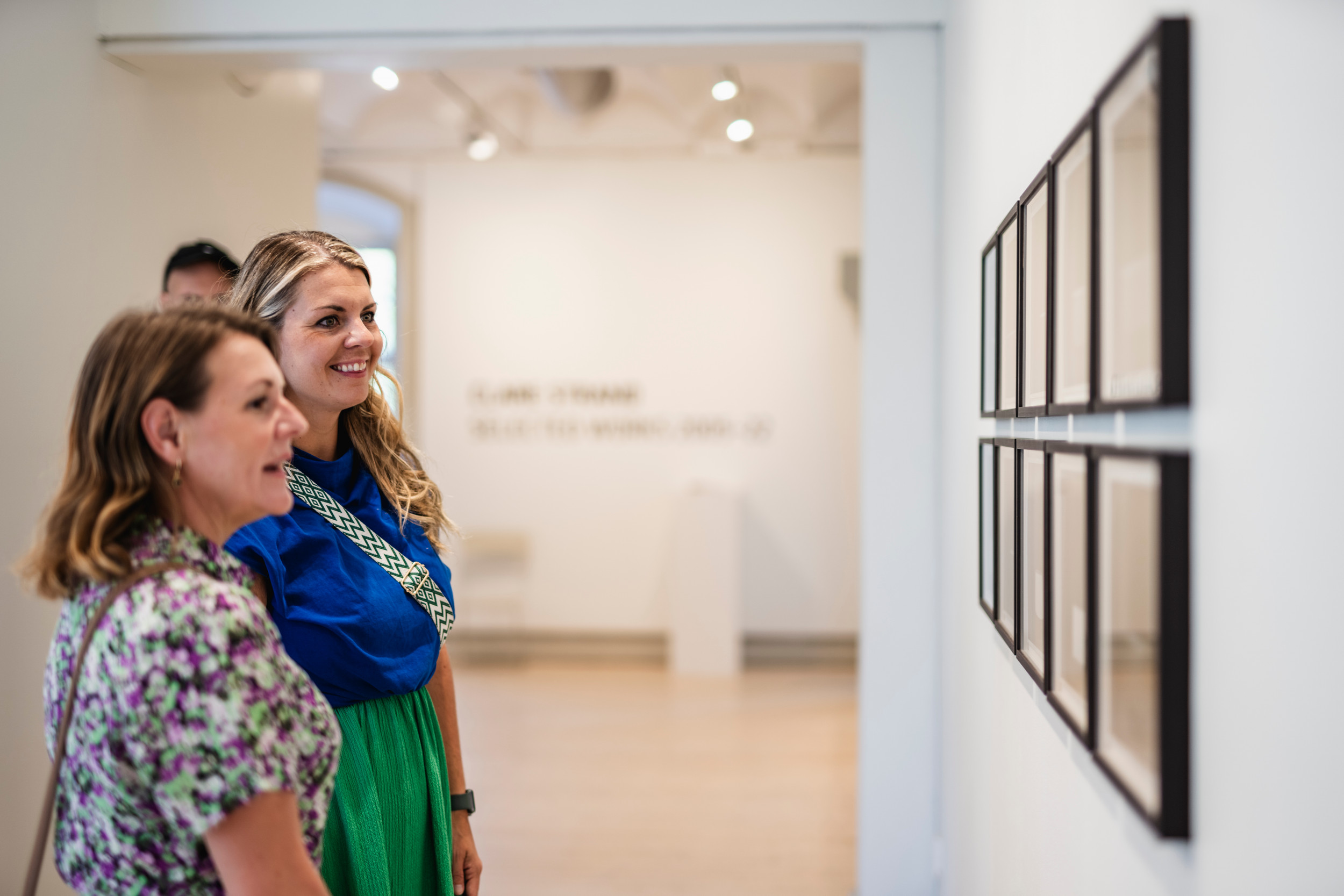 Two people looking at art