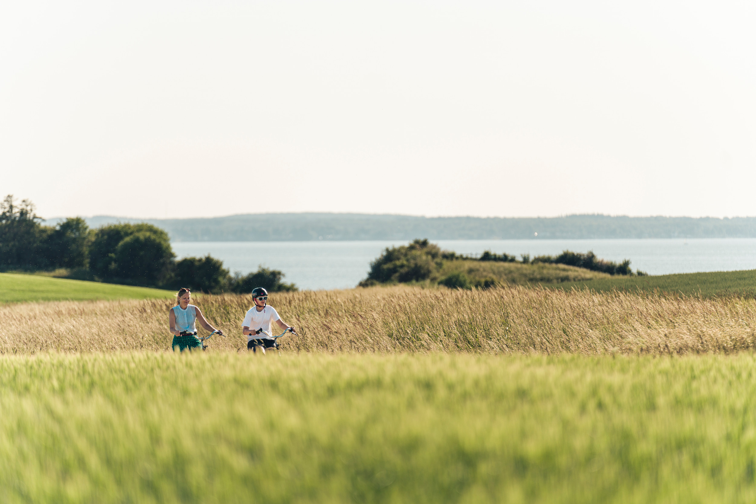 Two people biking